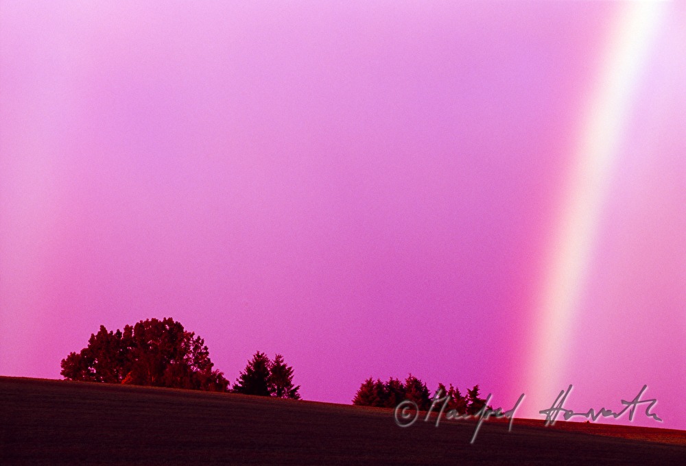 Regenbogen in Abenddämmerung